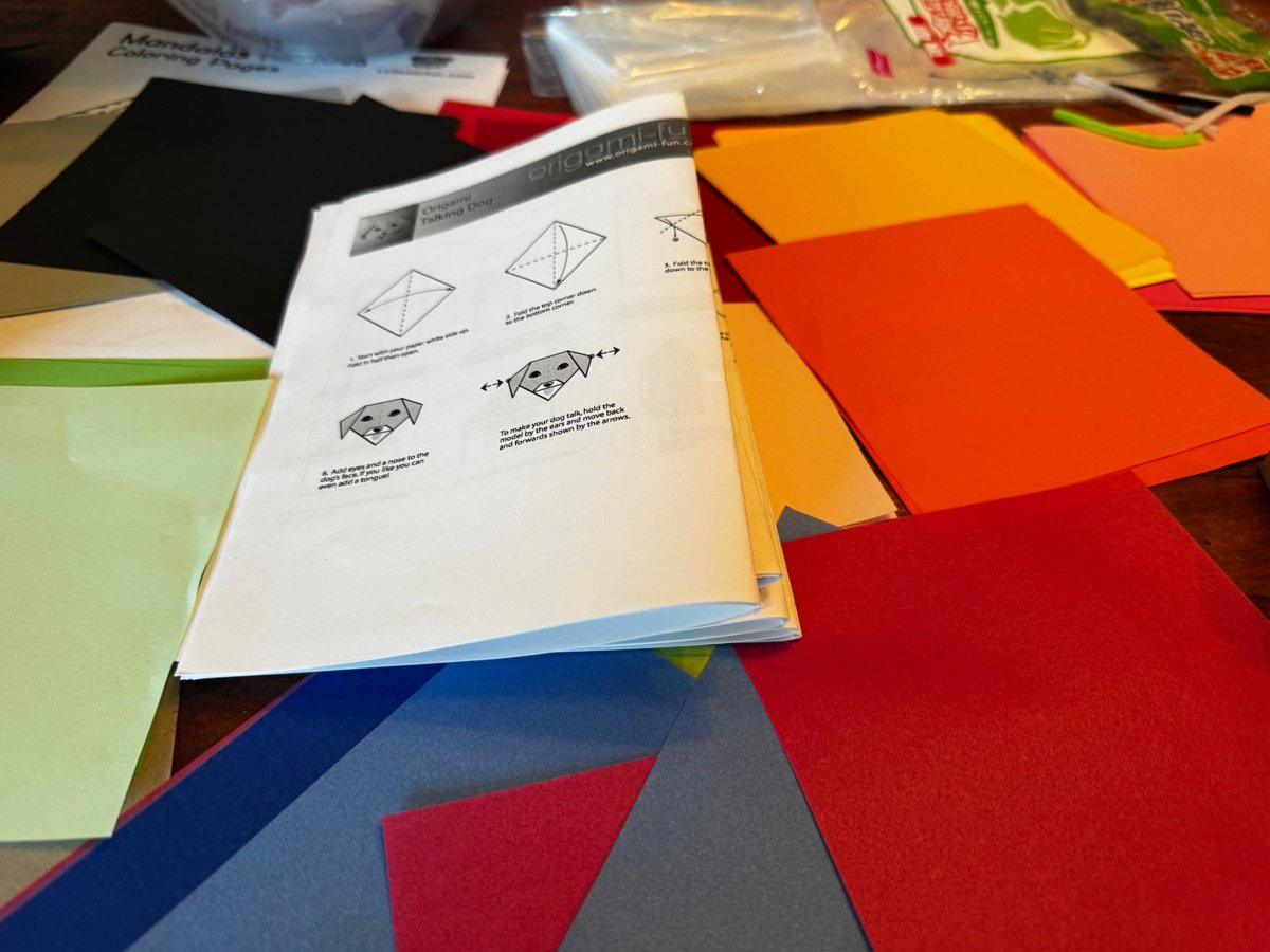 Origami instructions and colored origami paper from a Healthy Santa Clara origami kit